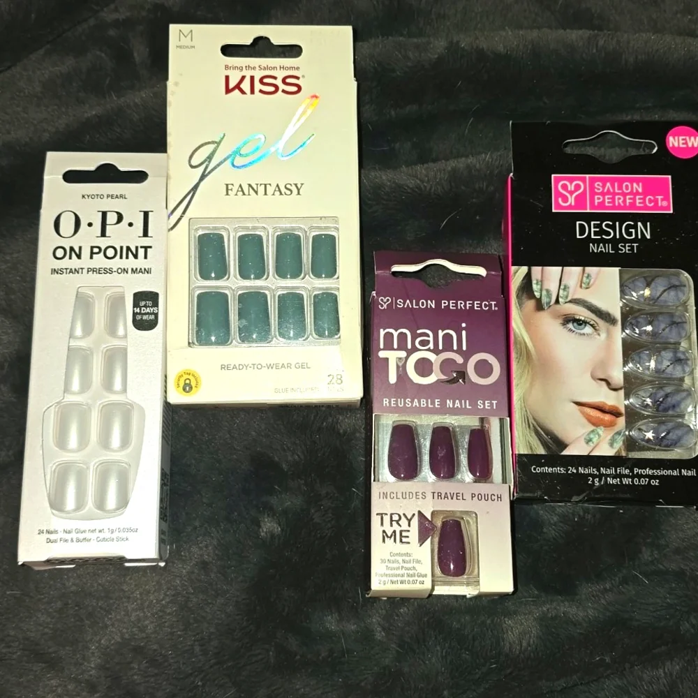 4 boxes of press on NAIL SETS.